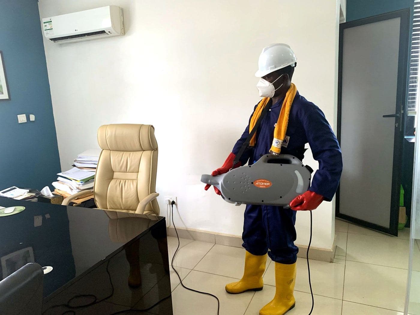 A White Wall cleaner disinfecting an office